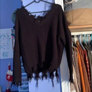 Black sweater with scarecrow arms
